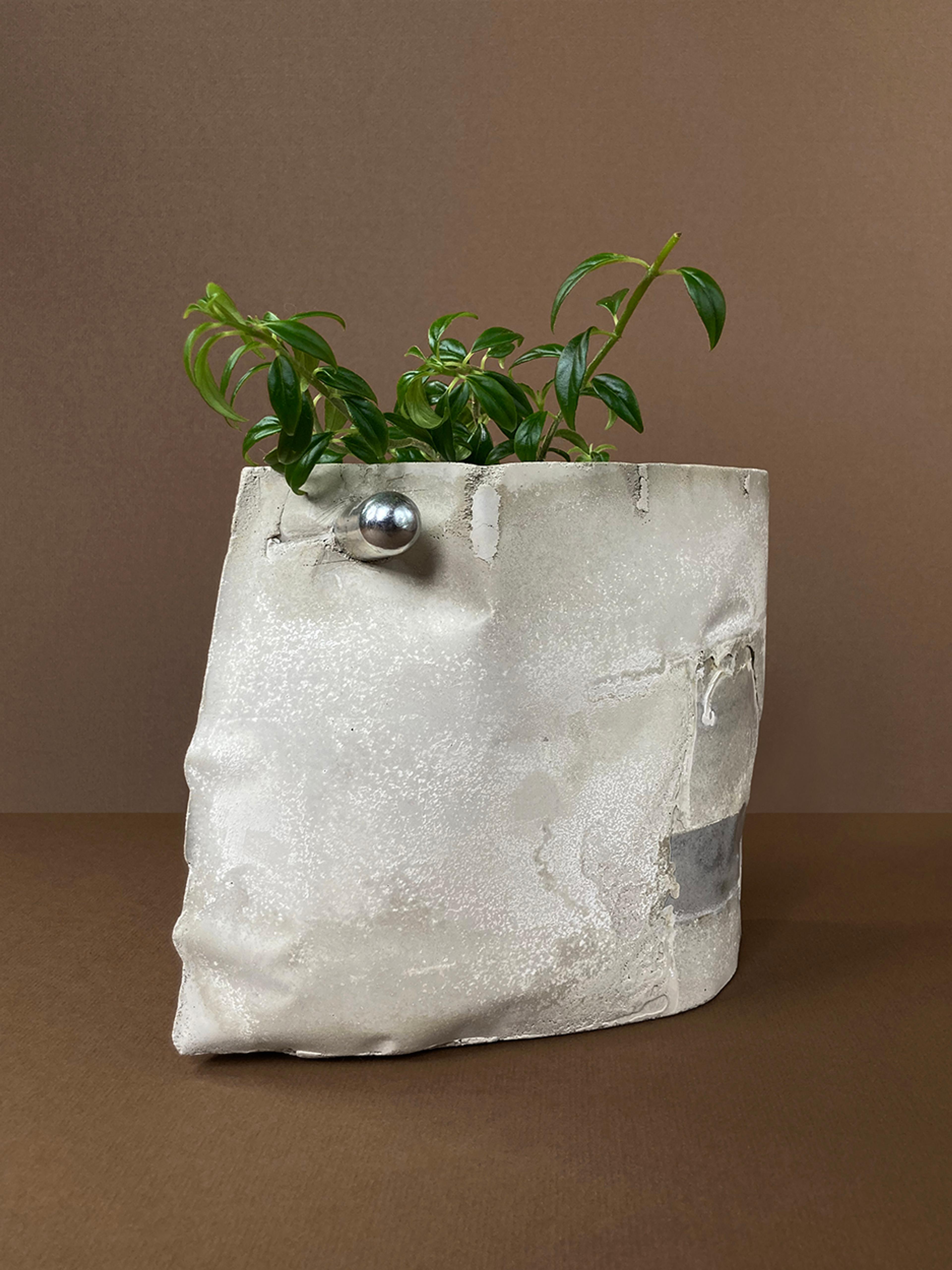 MOTHER — an irregular concrete planter with a single hardware knob, planted with a trailing vine, view 3 of 3