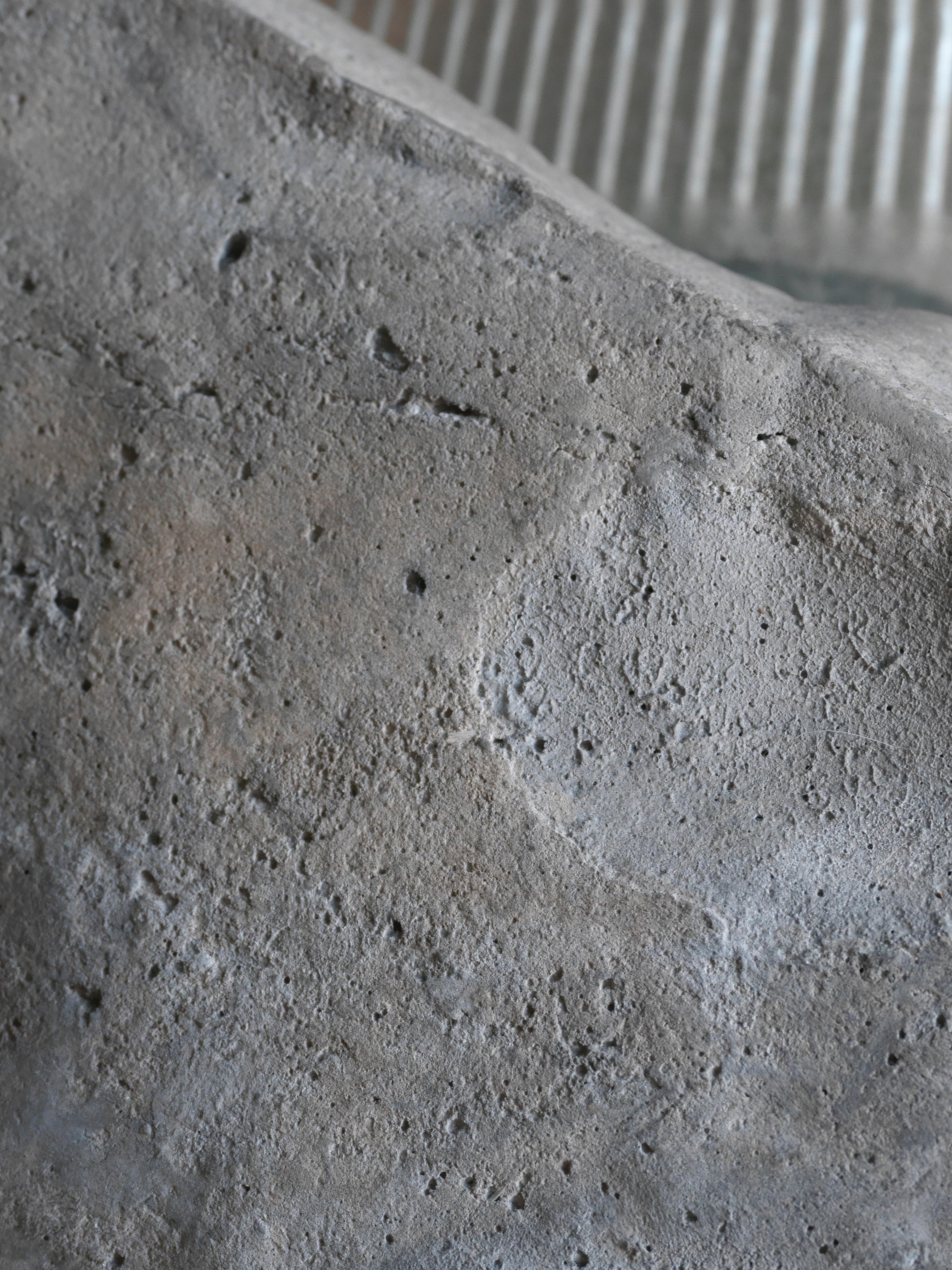 Beautiful Compromise — a surface detail of the concrete base. It is a concrete planter fused with a corrugated metal spout., view 2 of 2