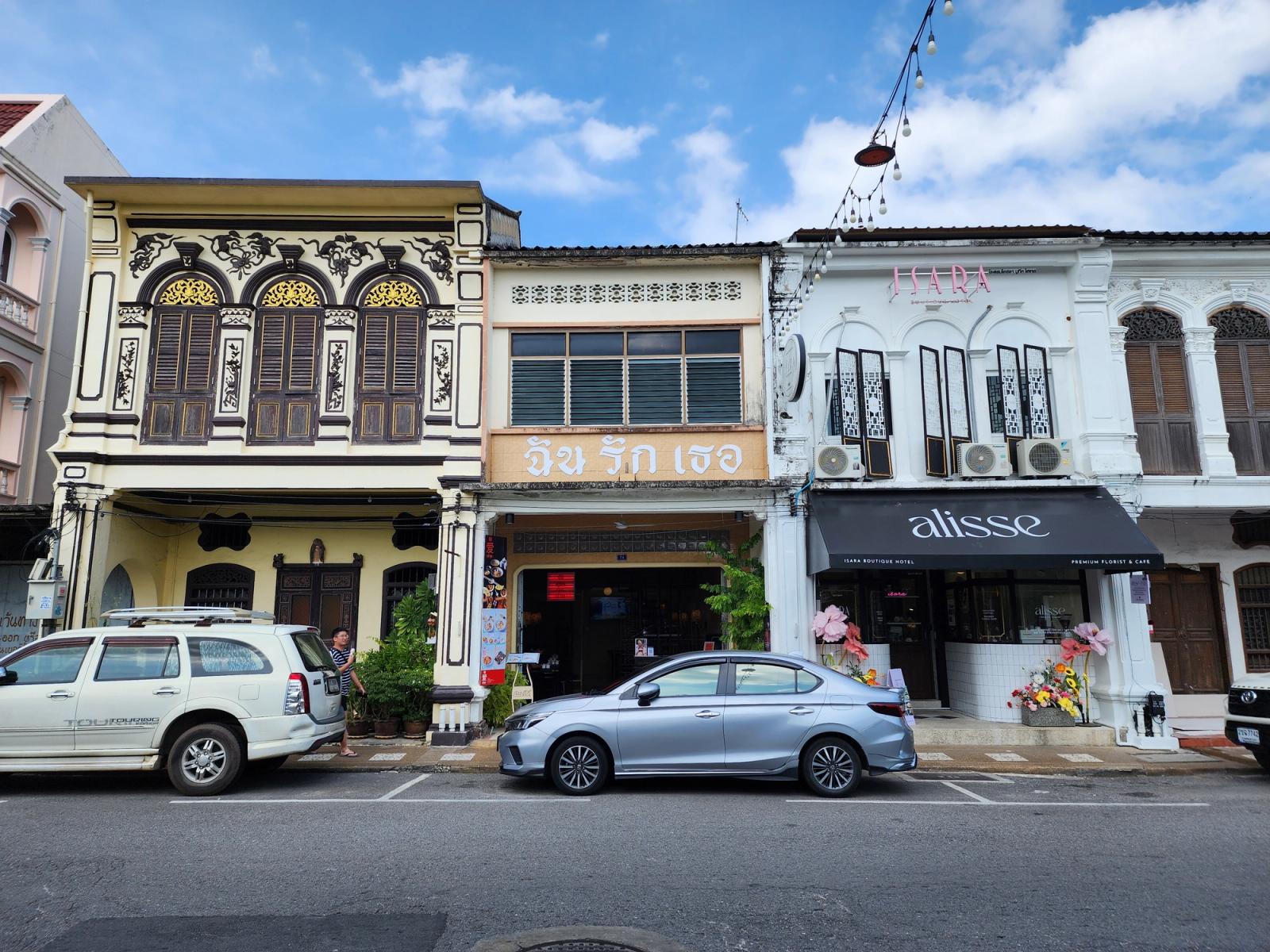 Sino-Portuguese shophouses on Thalang Road in Old Phuket Town in late-afternoon light.