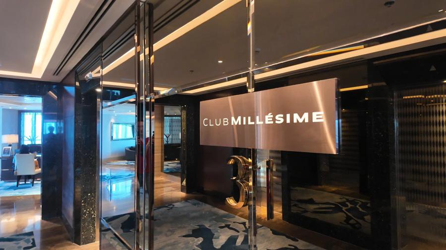 The Club Millésime sign and a large numeral 31 in the lift lobby of the 31st floor at Sofitel Bangkok Sukhumvit, with a blue patterned carpet.