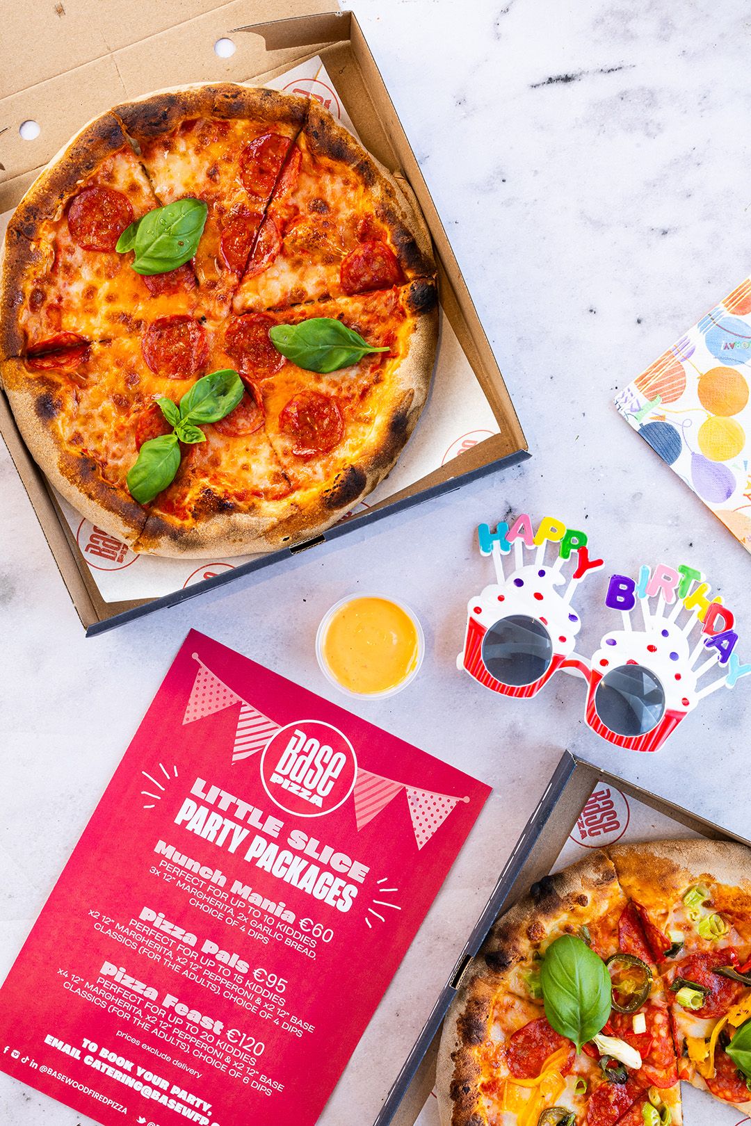 Pizzas, party cups and a kids party package flyer