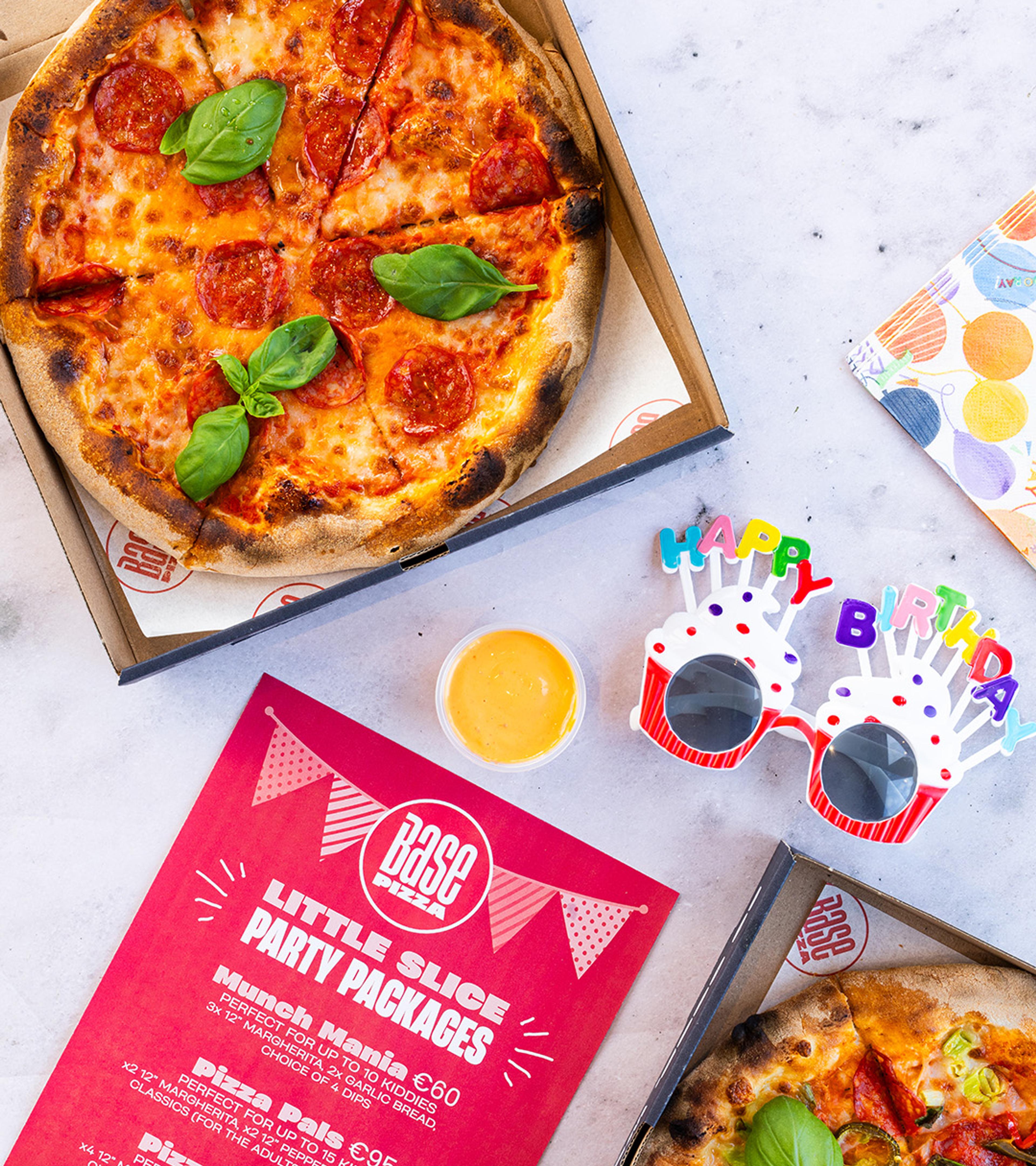 Pizzas, party cups and a kids party package flyer