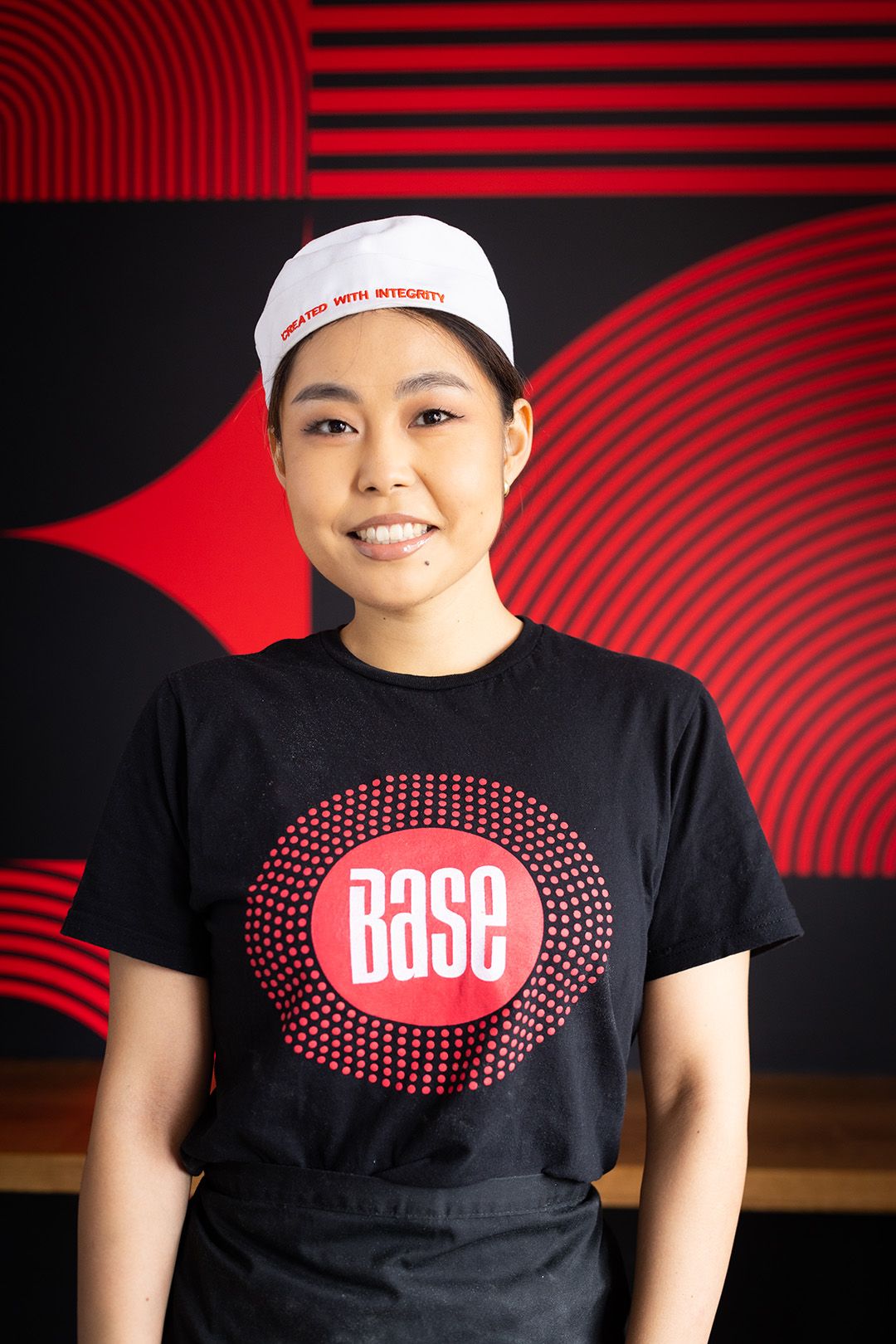 Smiling Base team member in a Base t-shirt