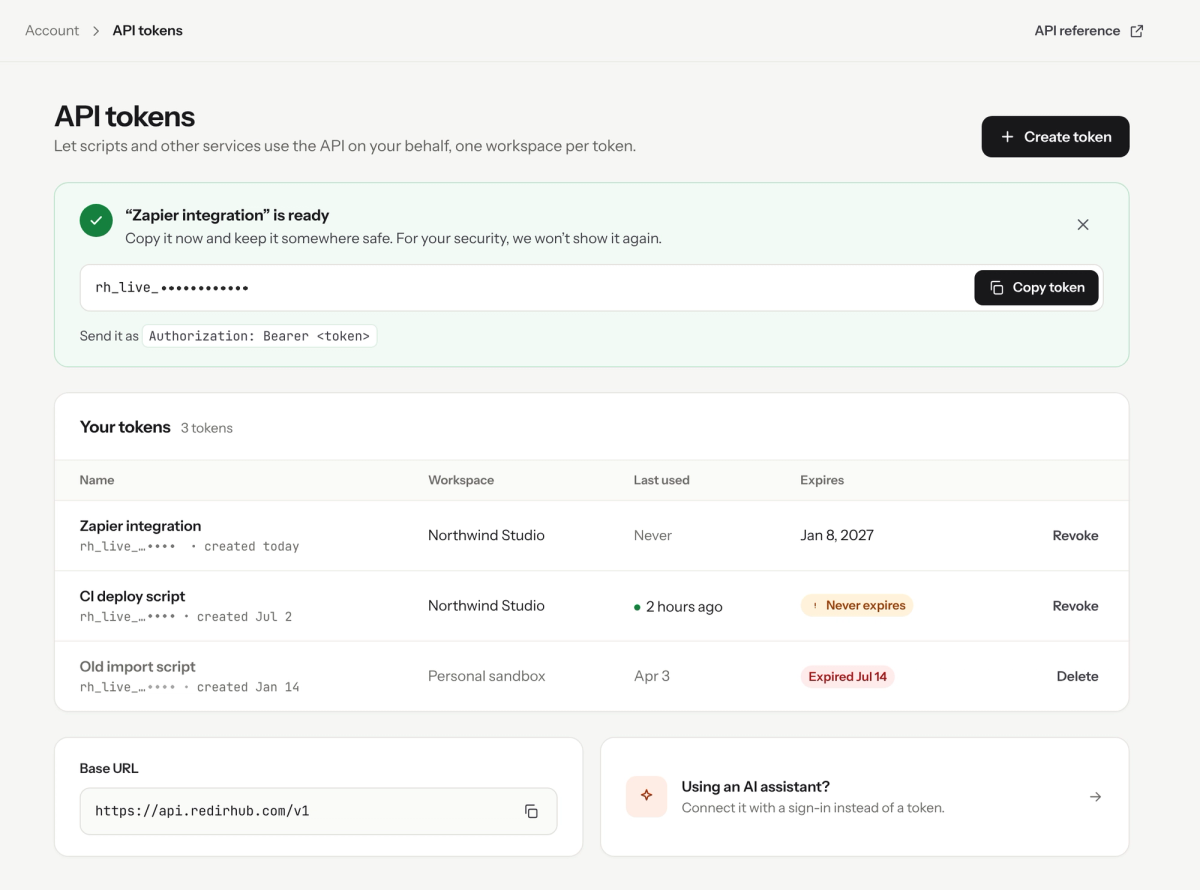 API tokens page with a newly created token, masked here, a Copy token button, and a list of three tokens with workspace, last used and expiry, including one that never expires and one expired