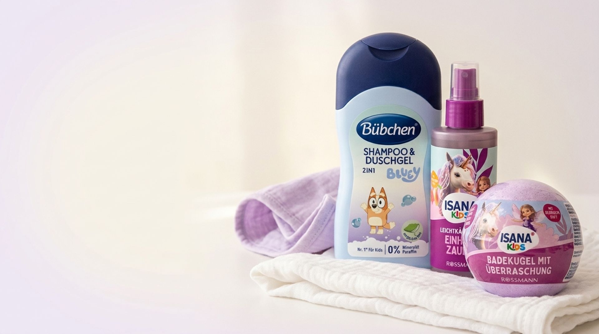 Baby skincare products from Balea and ISANA on a white muslin cloth