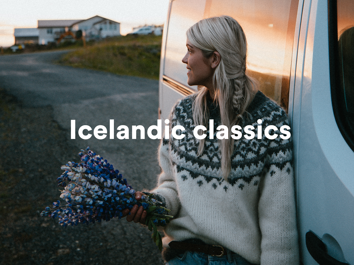 a woman holding a bouquet of flowers leaning against a van with the words icelandic classics above her