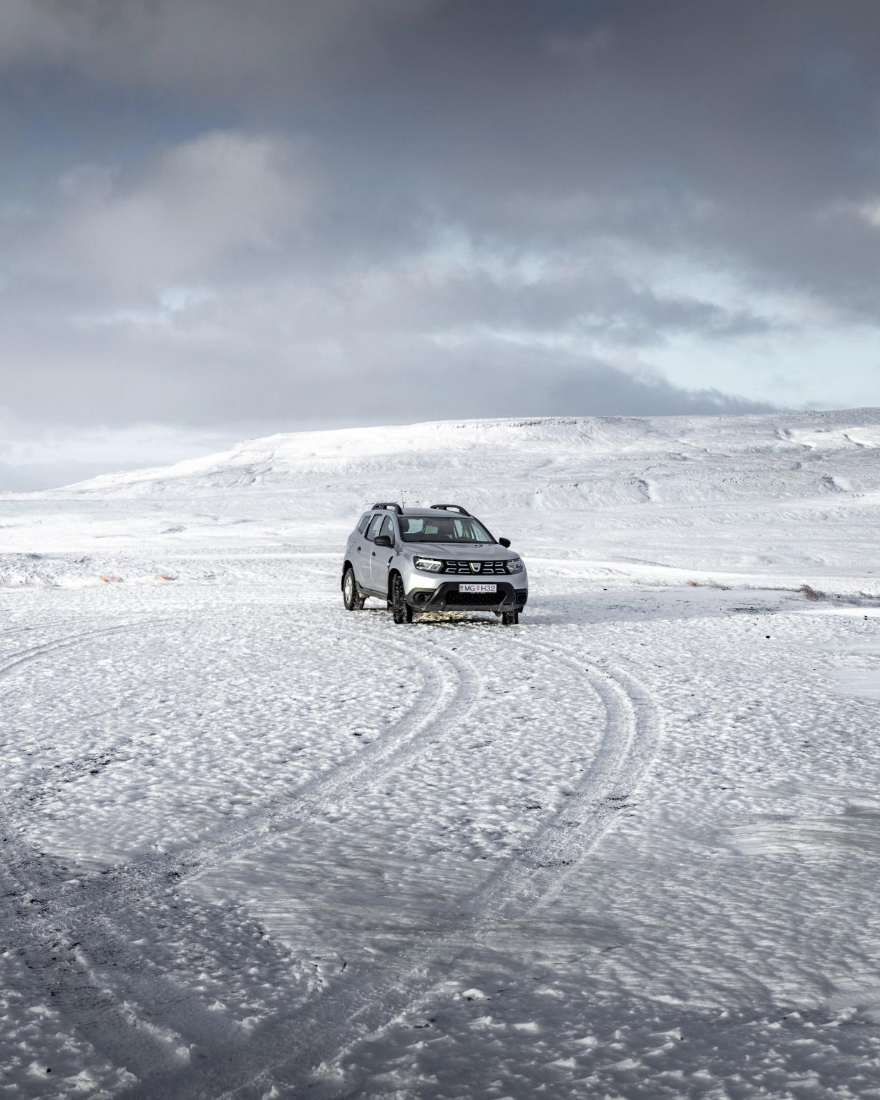 A Dacia Duster driving in winter in Iceland