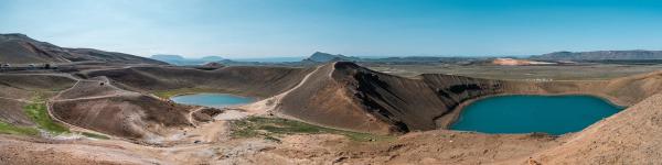 a panoramic view of a desert landscape with mountains and lakes, Askja