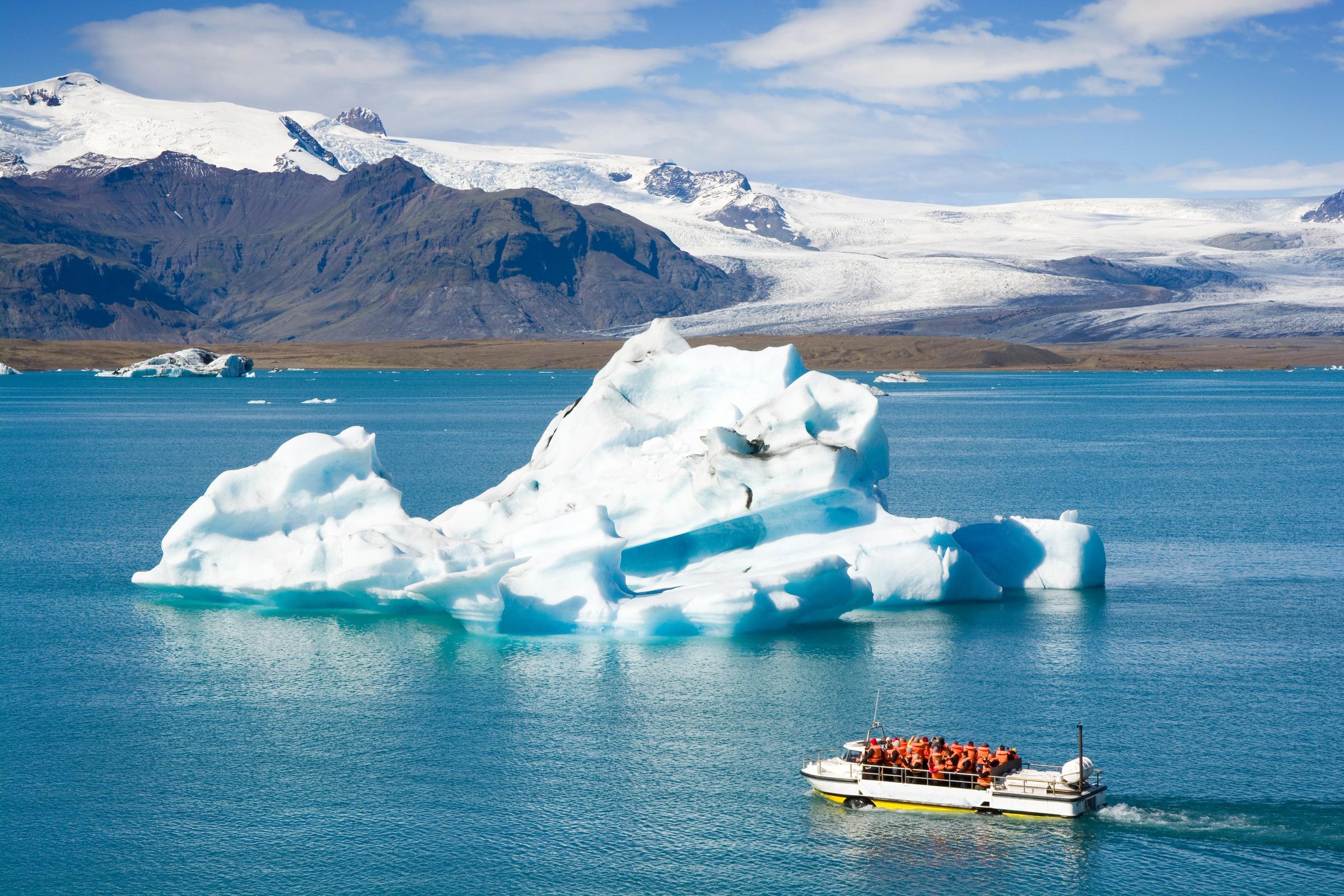 an amphibian boat next to an iceberg