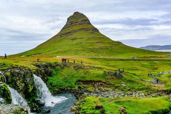 group pf people hiking Kirkjufell mountain