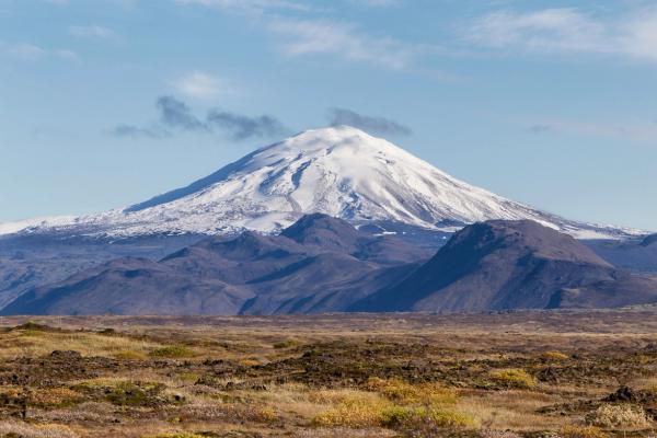 panoramic view of a volcano covered by snow
