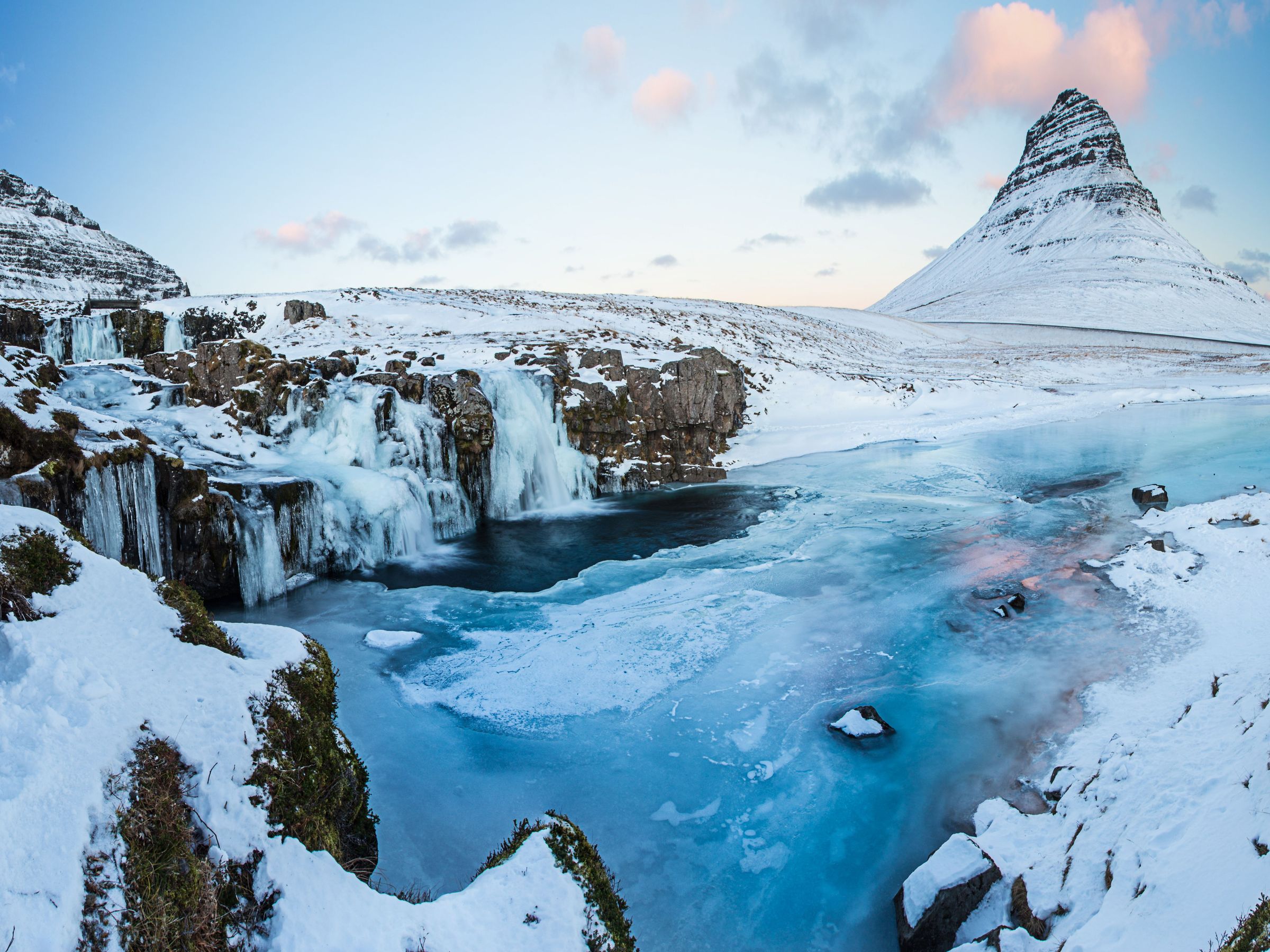 Kirkjufellsfoss and Kirkjufell all covered in snow
