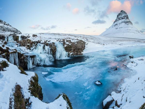 Kirkjufellsfoss and Kirkjufell all covered in snow