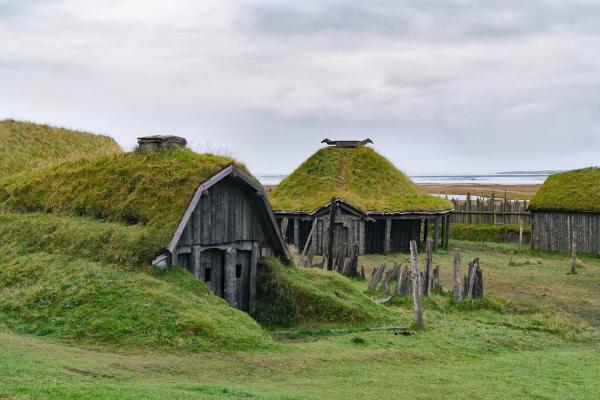 Old wooden houses covered by green moss