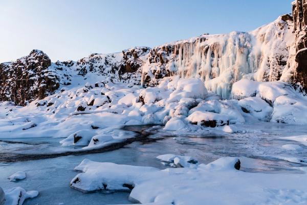 Öxarárfoss completely frozen and covered in snow