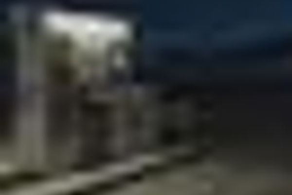 a blurry picture of a building at night .