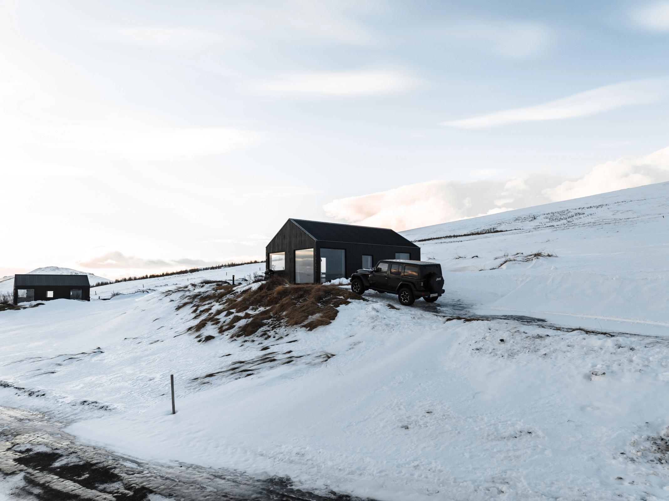 A picture of a rental car near a Accommodation cabin during november in iceland