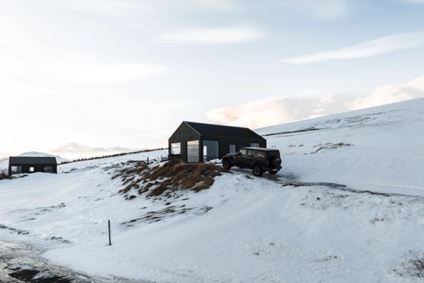 Accommodation A picture of a rental car near a Accommodation cabin during november in iceland