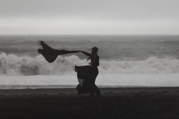 Girl at the beach in a windy day in Iceland
