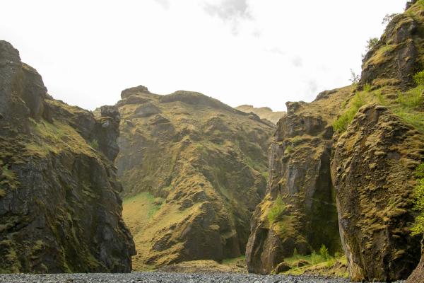 a river runs through a canyon between two mountains .