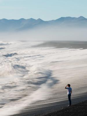 Man in a Black Sand Beach in Iceland