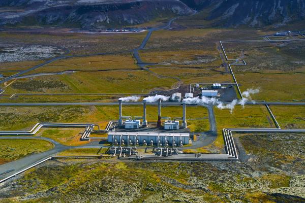 Harnessing Mother Nature's Power: A Geothermal Power Station nestled amidst the striking Icelandic landscape Aerial view of a geothermal power station in the rugged terrain of Iceland