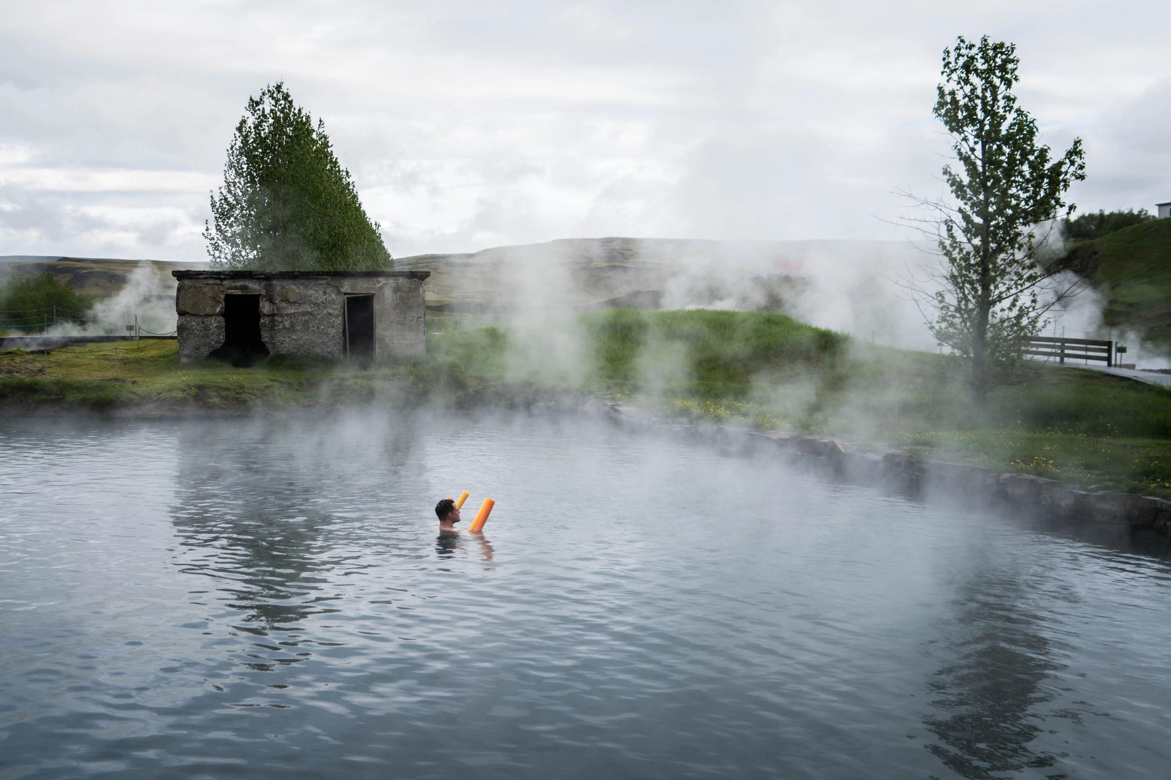 The Secret Lagoon Hot springs in iceland: Secret lagoon, a hot spring swimming pools located near the golden circle in Iceland
