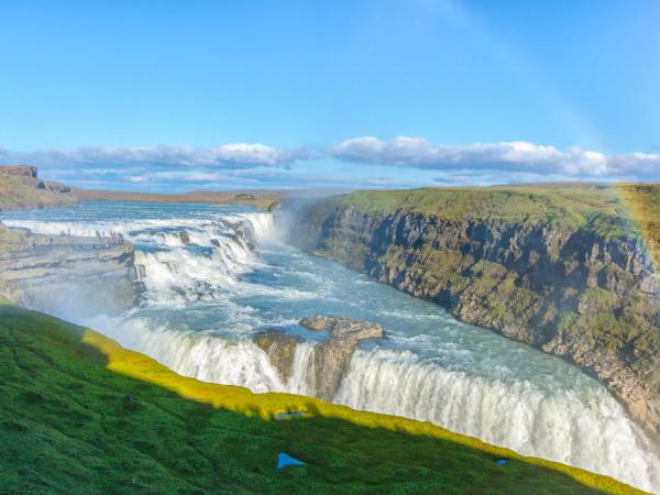 Gullfoss waterfall in iceland with a rainbow in front of it