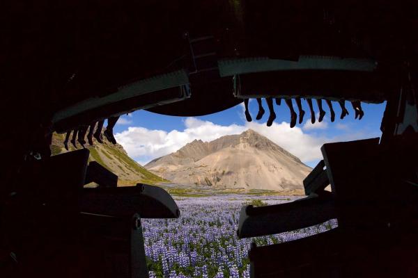 FlyOver feet dangling FlyOver Iceland riders feet dangling wiht a mountain in the background