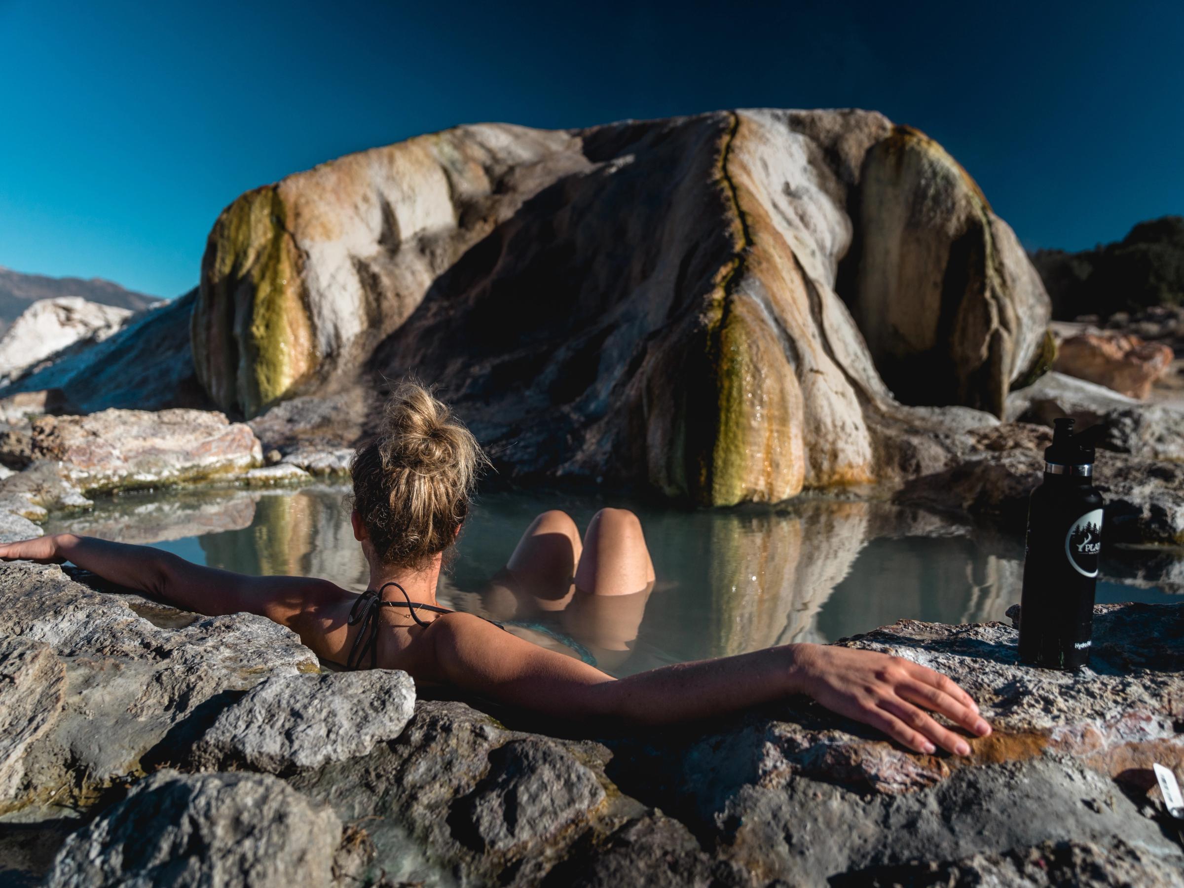 woman bathing in natural hot spring