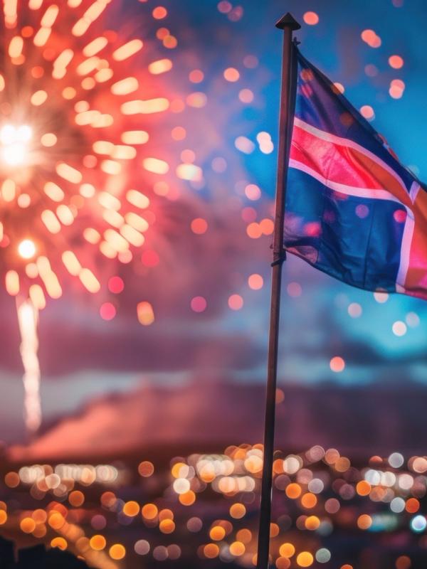 Iceland flag is flying in front of a fireworks in downtown Reykjavík in Iceland.