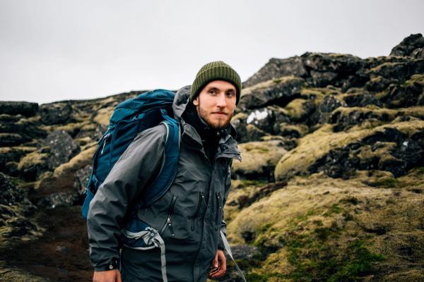 Happy portrait of young  hiker enjoying the outdoors activity in September in Iceland