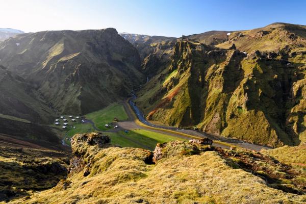 a view of a valley from the top of a mountain at Þakgil campsite in iceland.