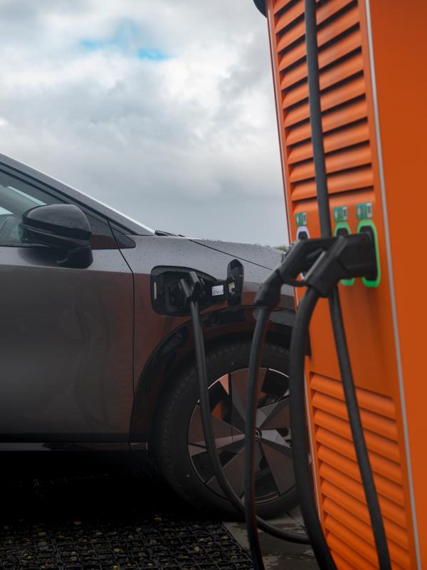 an electric car is being charged at a charging station