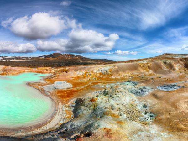 a panoramic view of a lake in the middle of a desert at Leirhn´jukur by lake mývatn in north iceland.