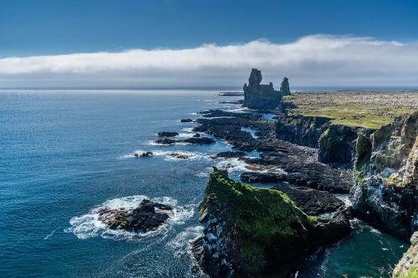 Cliffs with two basalt pinnacles on a sunny day