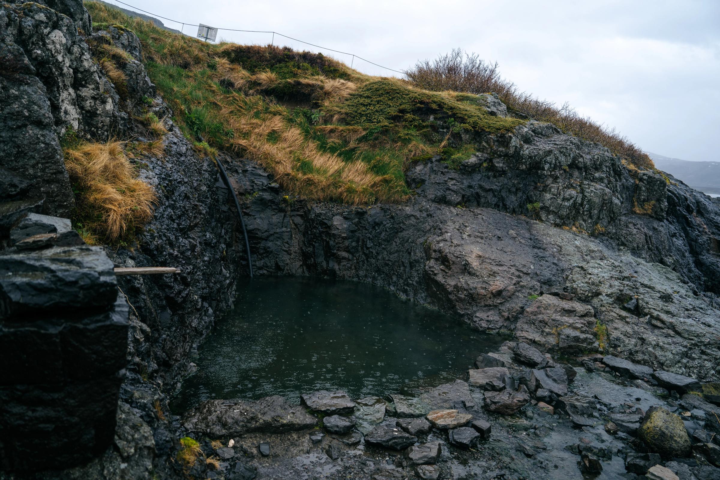 Hellulaug hot pool on the coast of Vatnsfjörður fjord in the Westfjords of Iceland.