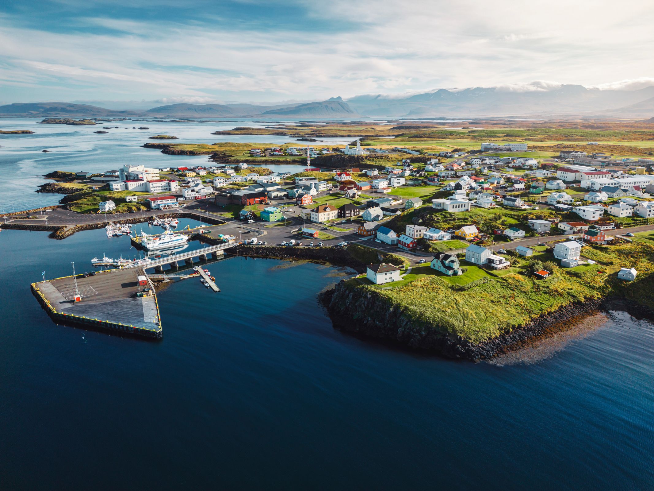 an aerial view of a small town in the middle of the ocean .