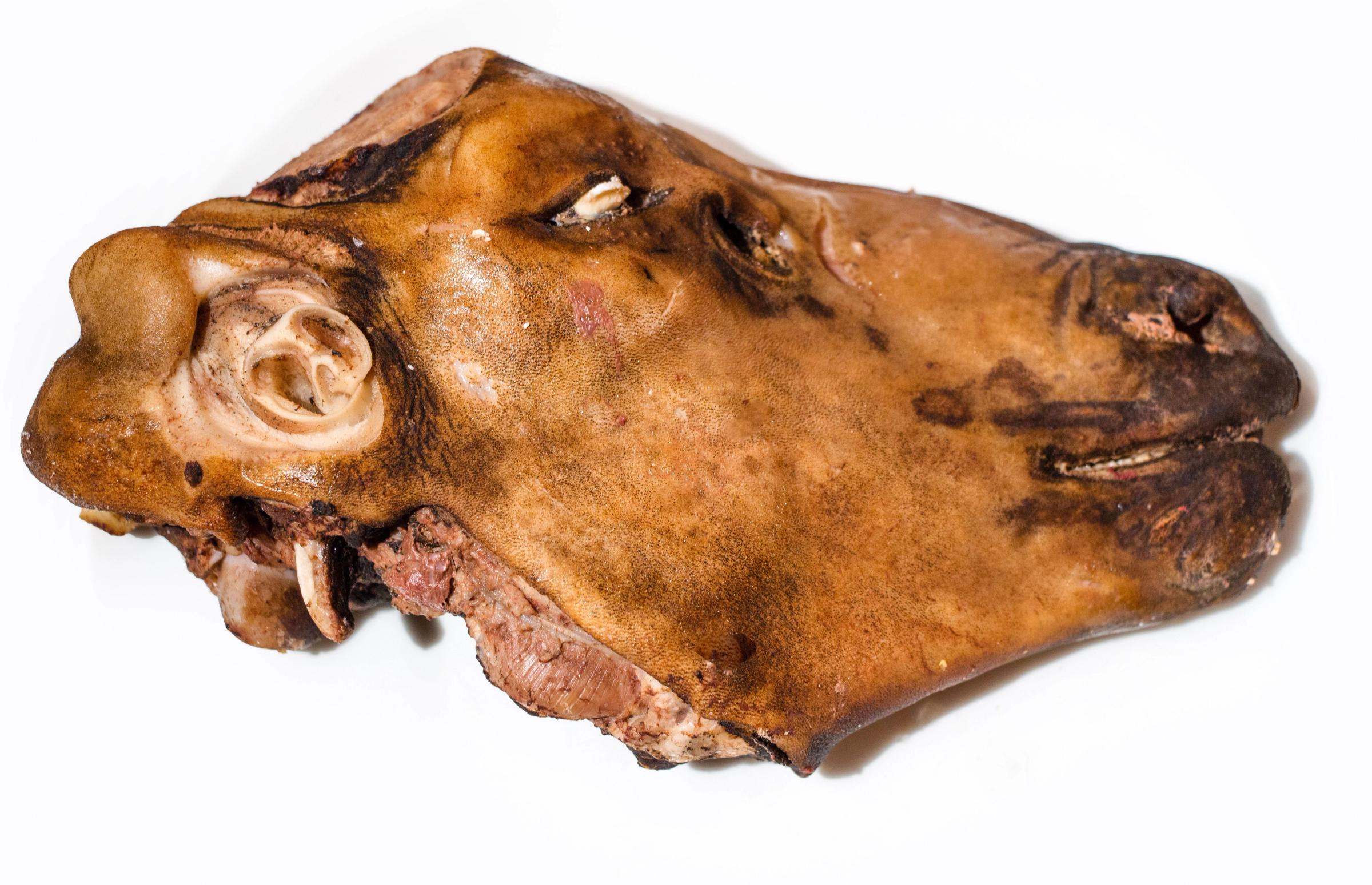 a close up of a piece of meat on a white background .