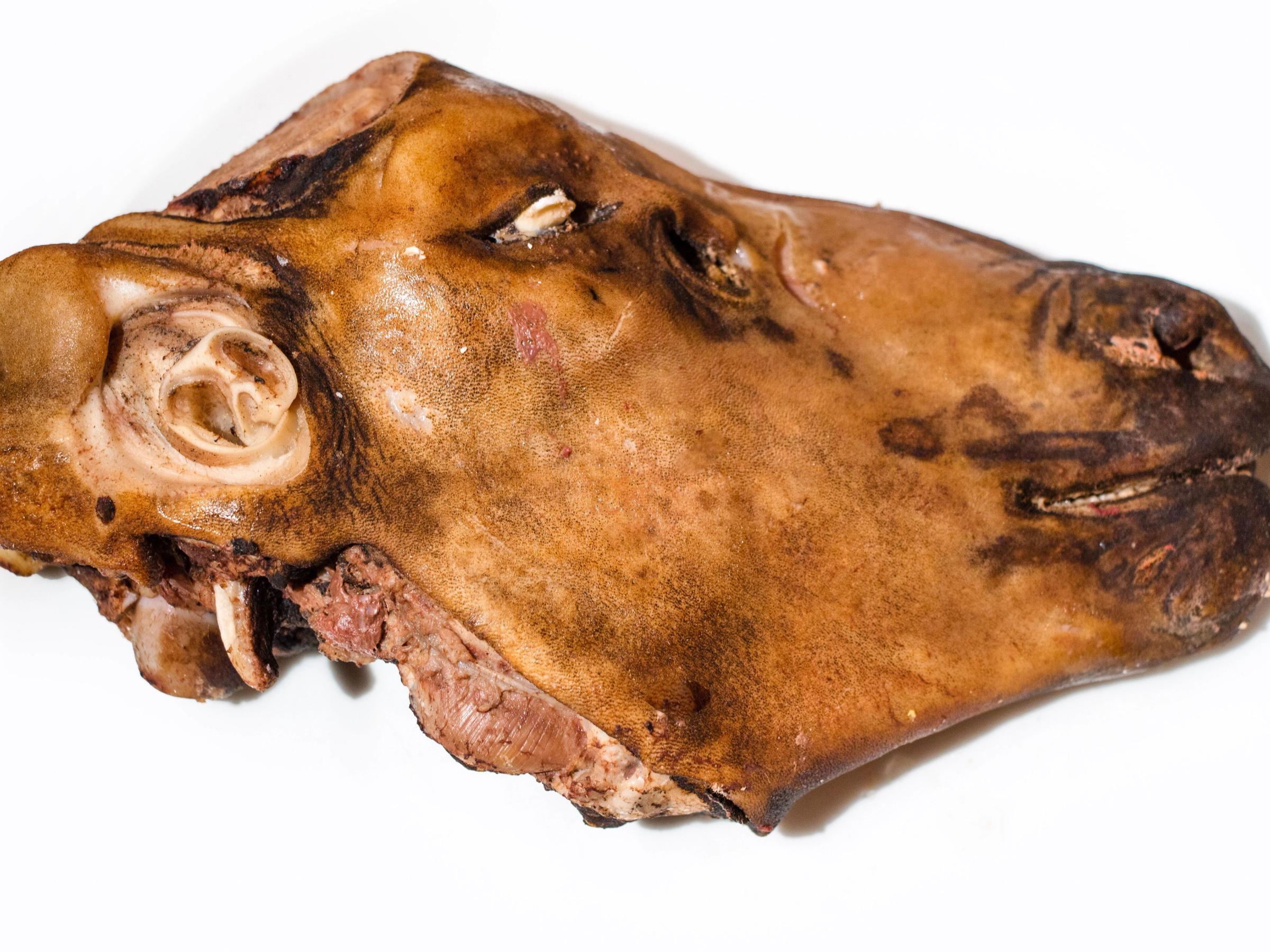 a close up of a piece of meat on a white background .