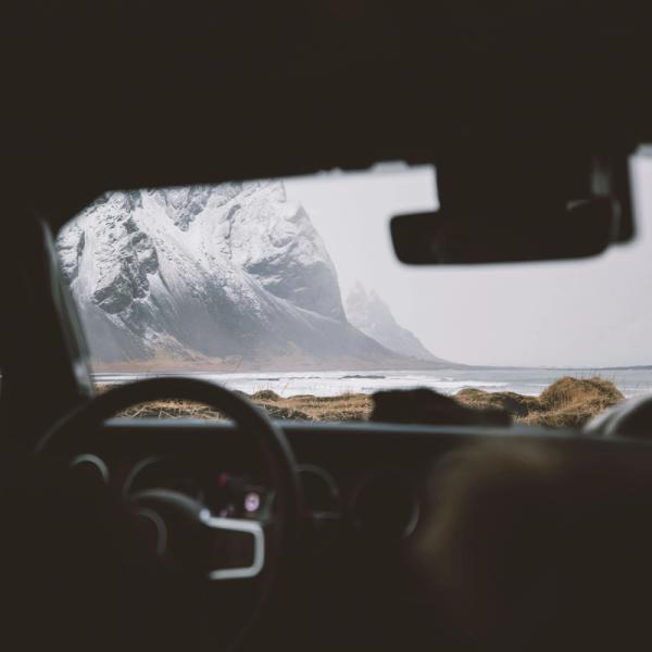 View from inside a car of a snowy moutain