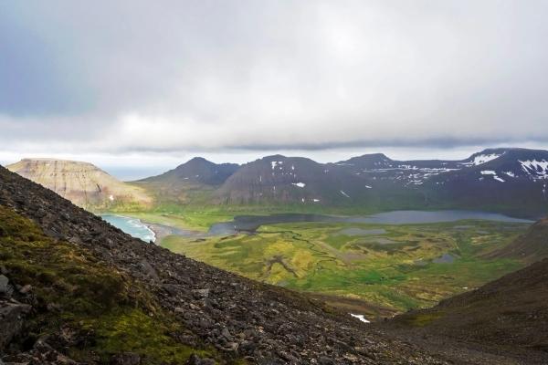 View on beautiful snow covered cliffs and fljotsvatn lake in Fljotavik cove in Hornstrandir