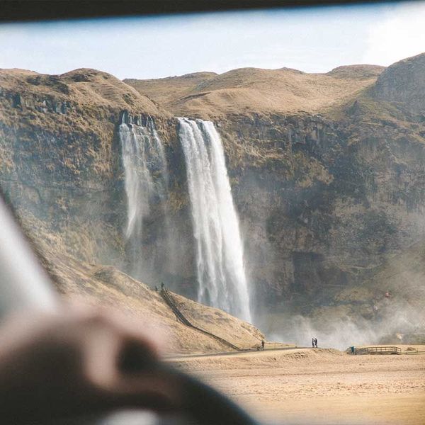 View of a waterfall in Iceland from the car