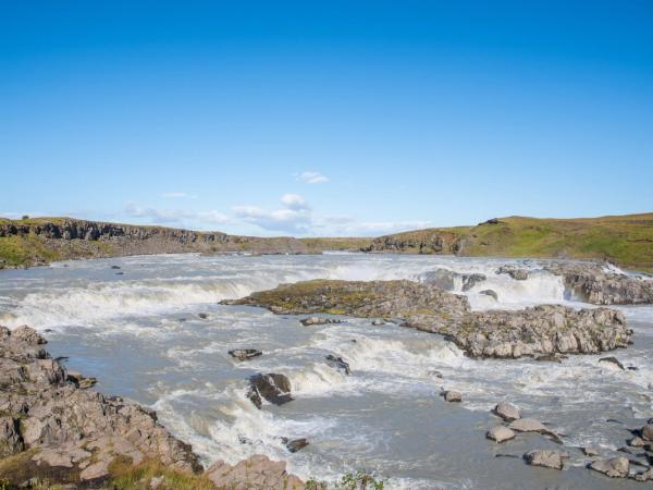 there is a waterfall in the middle of the river .