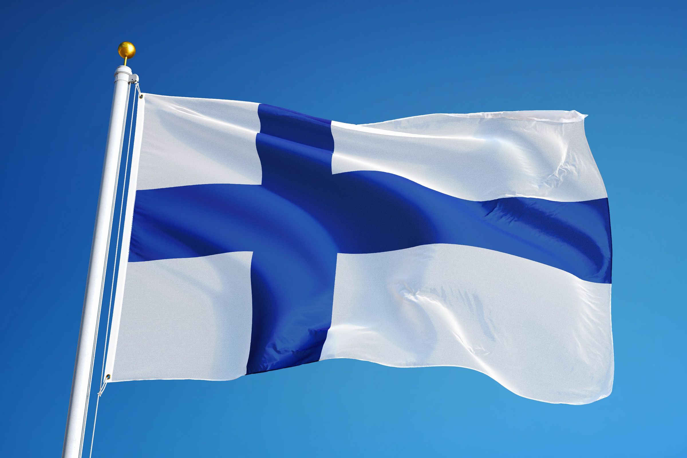 Finland Finland flag waving against clean blue sky