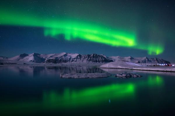 Jokulsarlon glacier Lagoon and northern lights Amazing panoramic view on the Jokulsarlon glacier Lagoon, and its green northern lights