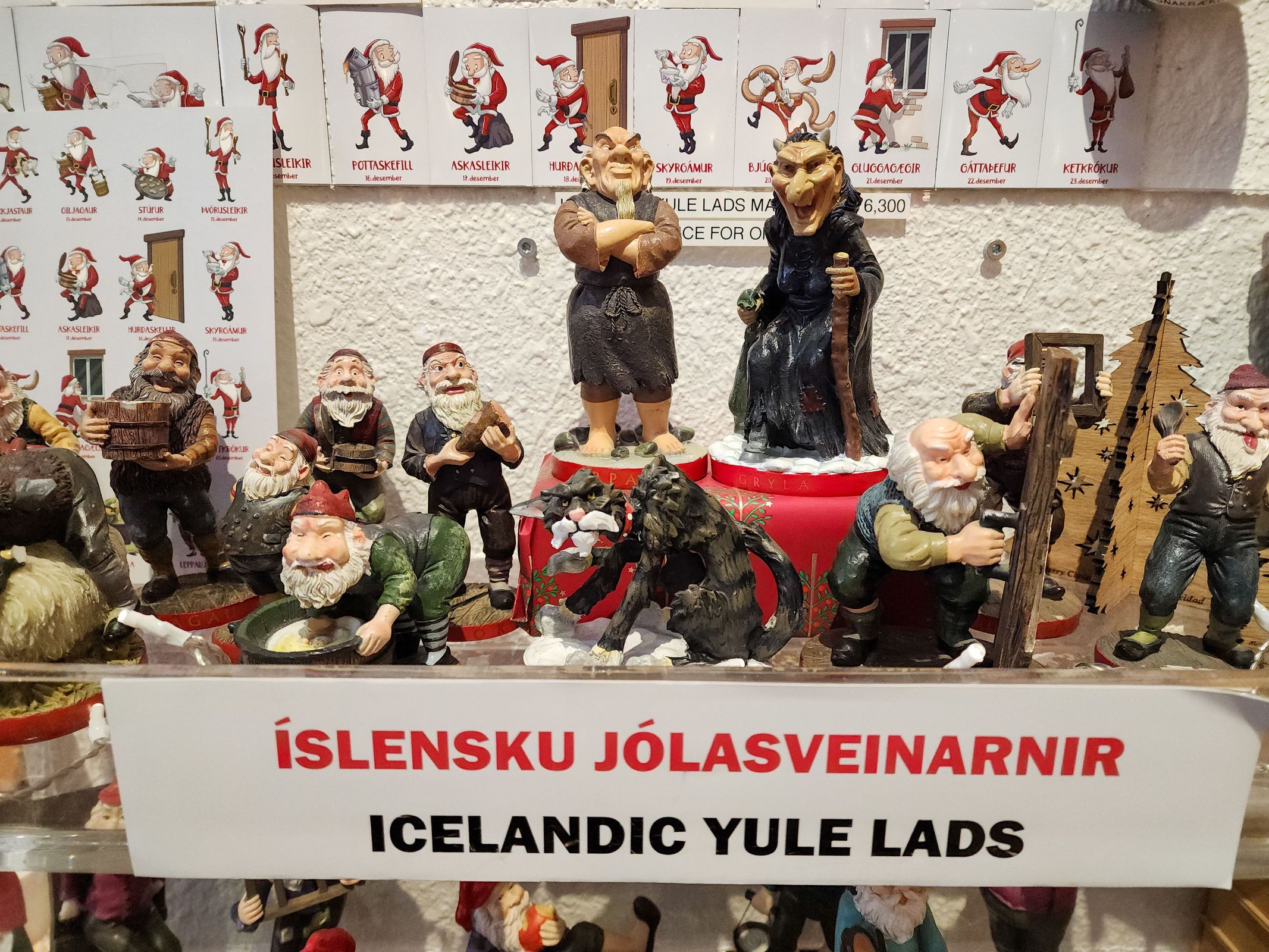 a display of icelandic yule lads figurines on a table .