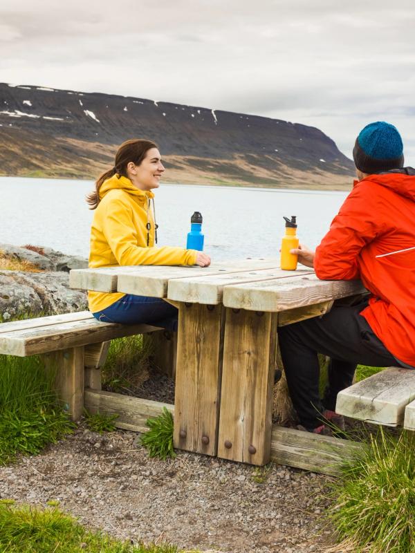 eco-friendly tourists enjoying nature, Iceland 2 tourists having a nice day in Iceland, and taking advantage of the magnificent landscapes of this country to take a break