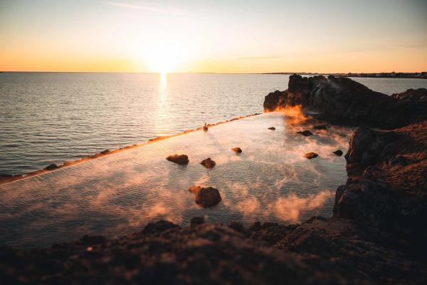 Hot spring near the sea while the sun is setting