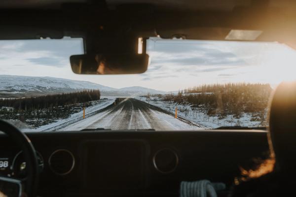 Driving in iceland Rental car in iceland driving a paved snowy road